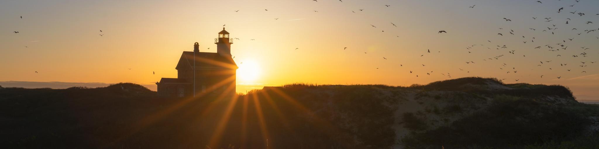 Scenic silhouette of the North Lighthouse during sunset on Block Island