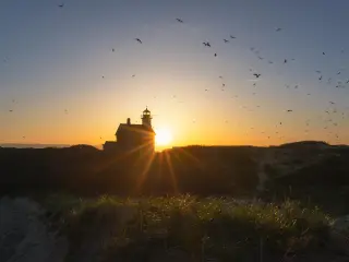 Scenic silhouette of the North Lighthouse during sunset on Block Island