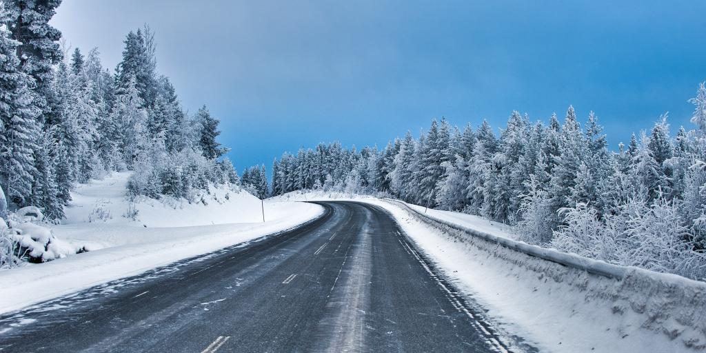 A snowy road on a sunny day