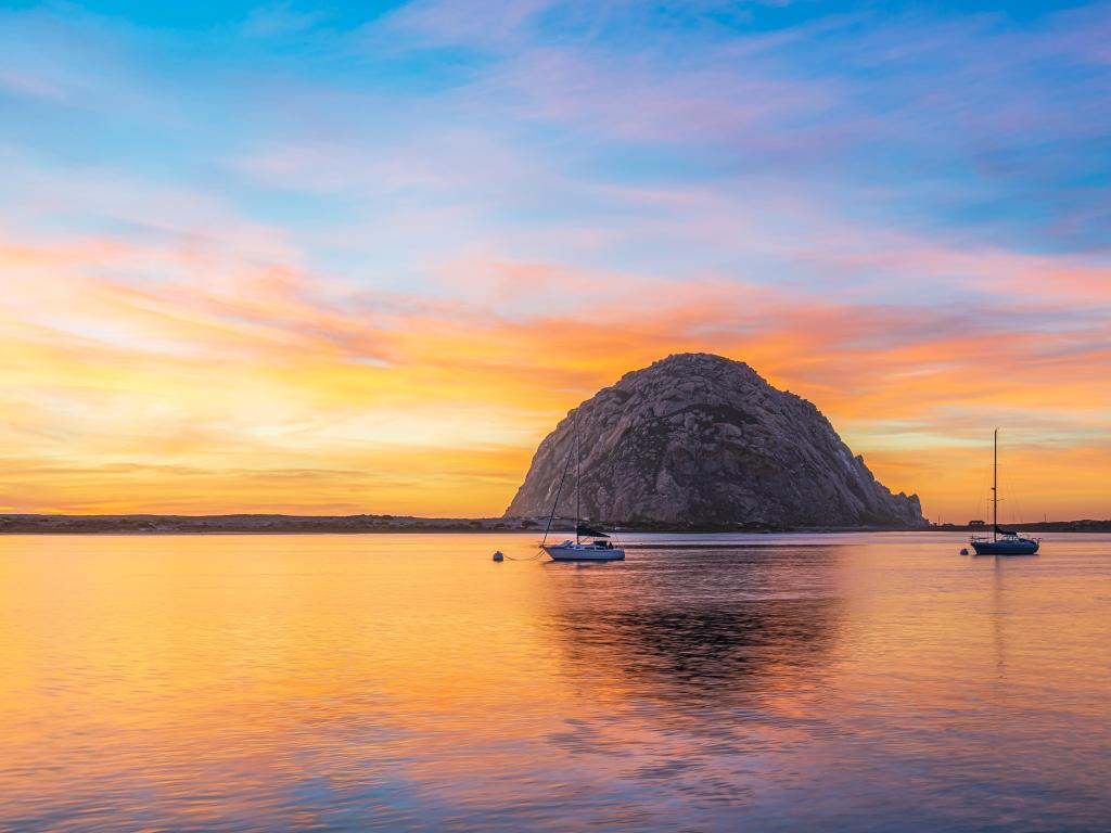 Morro Rock at sunset with boats in the foreground, Morro Bay California