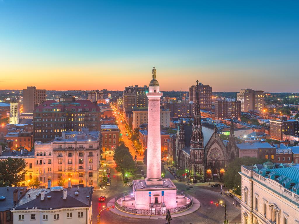 Baltimore, Maryland, USA with the cityscape at Mt. Vernon and the Washington Monument at early evening.