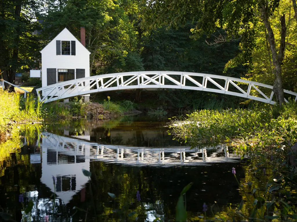 White wooden bridge reflected in a pond, Somesville, Mount Desert Island, Maine, USA