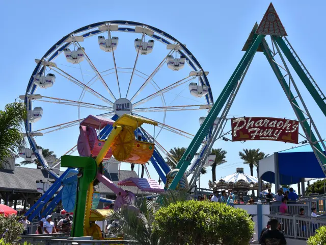 Fun rides and Ferris wheel on Kemah Boardwalk, photo taken during a sunny day