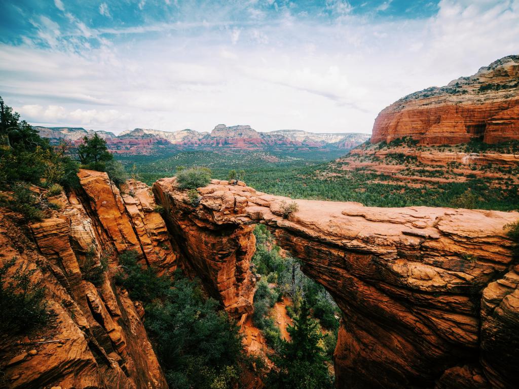 Broad angle view of the panoramic landscape of the Devils Bridge Trail in Sedona, Arizona.