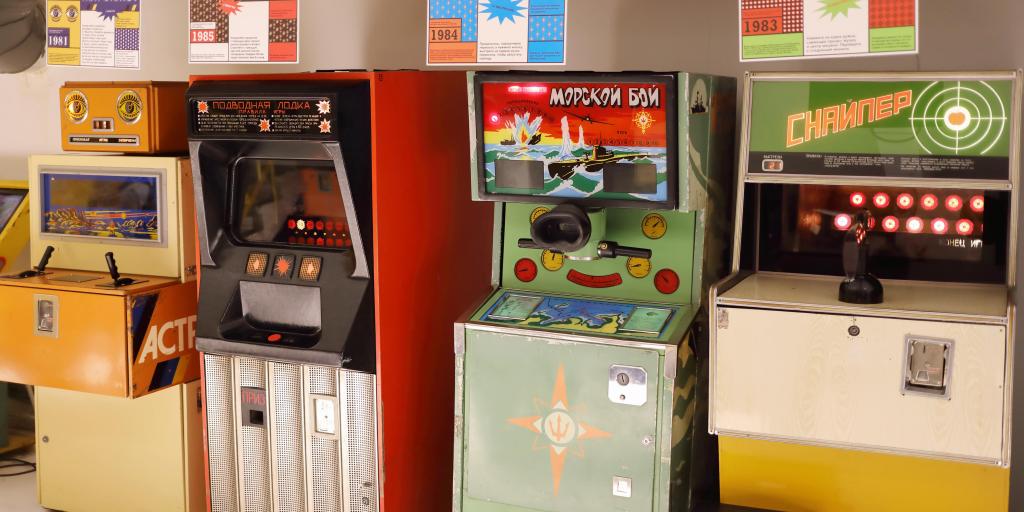 Four old arcade machines lined up against a wall at the Museum of Soviet Arcade Machines, Moscow