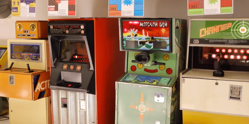 Four old arcade machines lined up against a wall at the Museum of Soviet Arcade Machines, Moscow