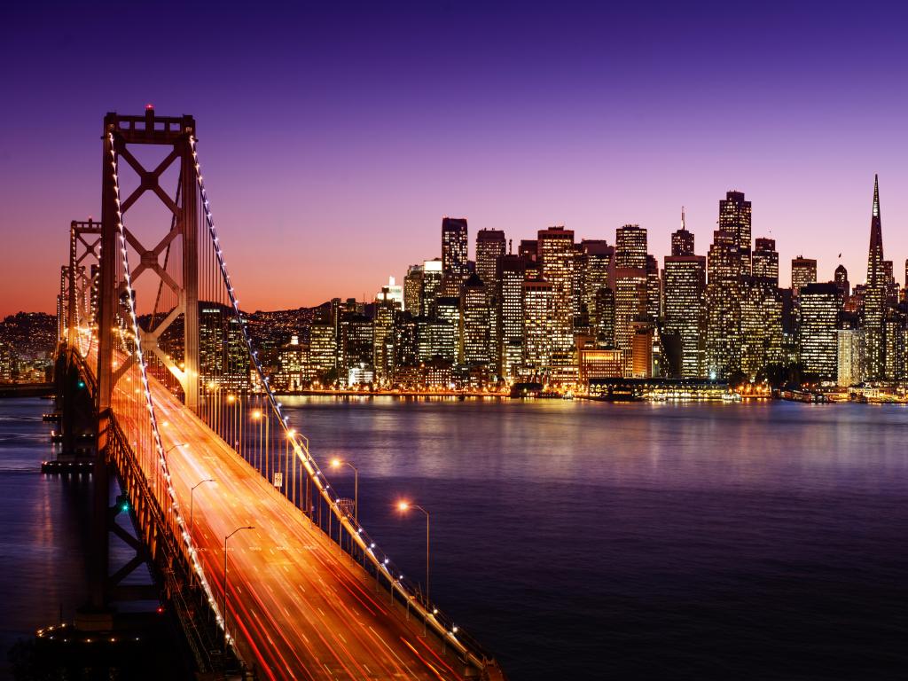 San Francisco skyline and Bay Bridge at sunset, California