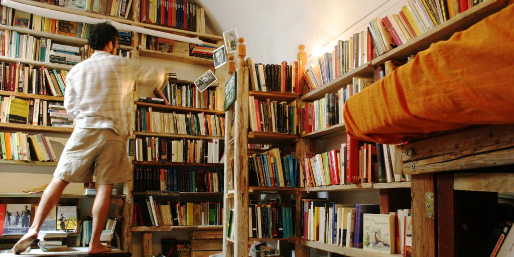 A man rifles through the bookshelves at Atlantis Books in Santorini