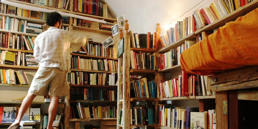A man rifles through the bookshelves at Atlantis Books in Santorini