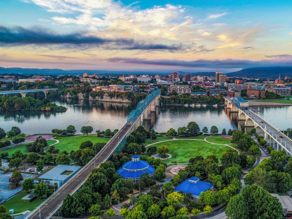Chattanooga, Tennessee, USA taken as an aerial drone view of the downtown city with the Tennessee River in the distance and taken at sunset.