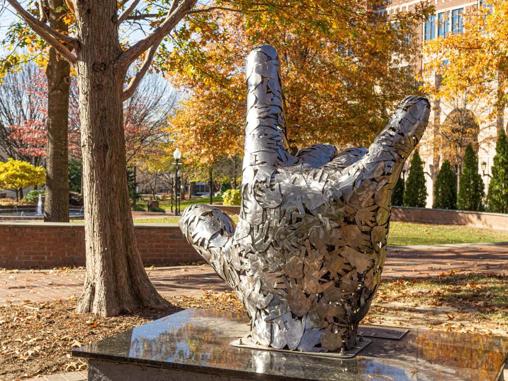 Metal hand sculpture in downtown Spartanburg signs 