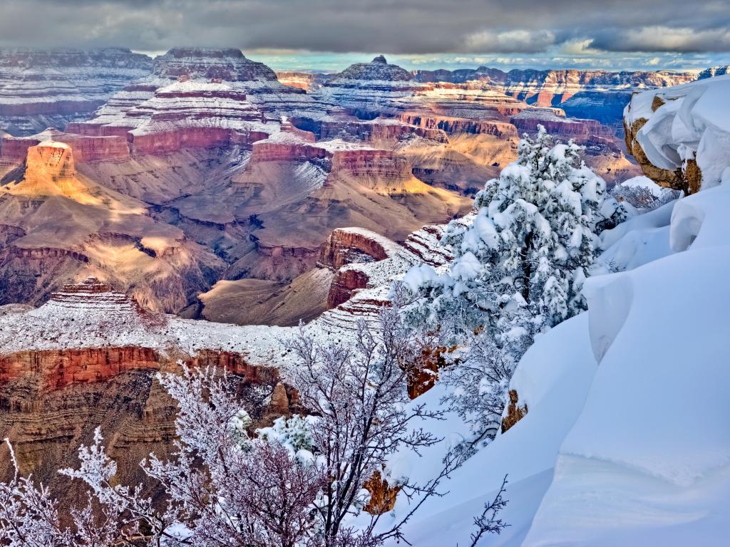 Clearing storm over south rim, Grand Canyon, Arizona in winter with slow over the canyon.