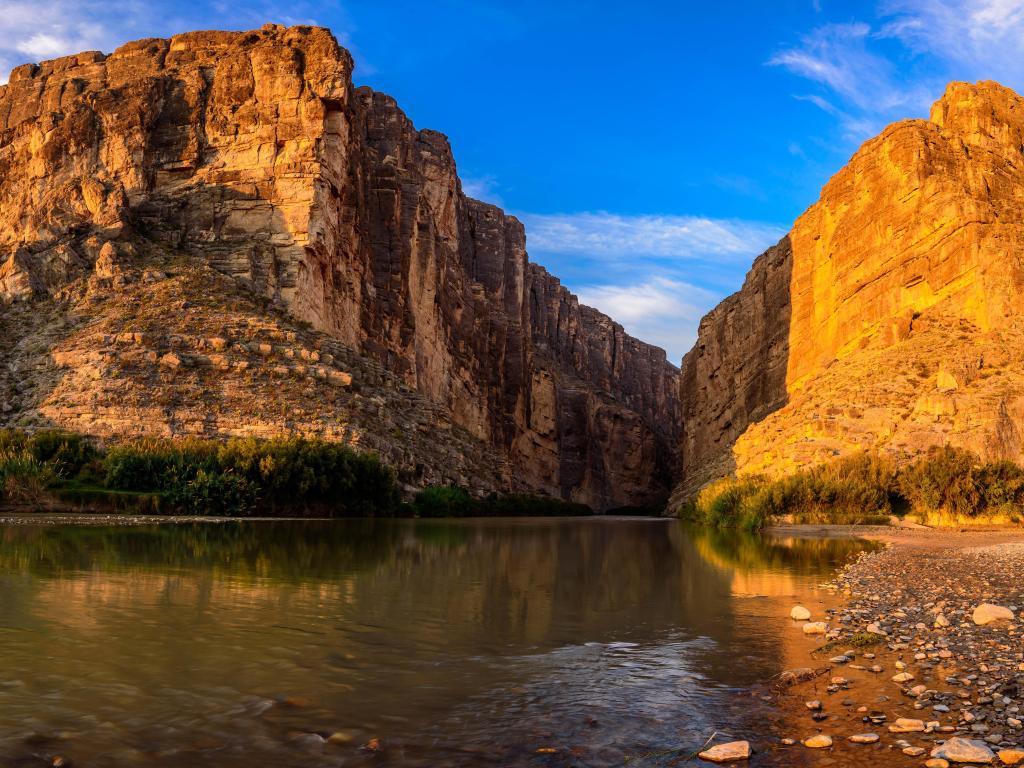 Santa Elena Canyon at Big Bend National Park, Texas, USA with the sunset behind the canyons in the distance. 