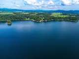 Aerial view of the scenic green landscape and blue lake and skies across Lake Champlain, New York