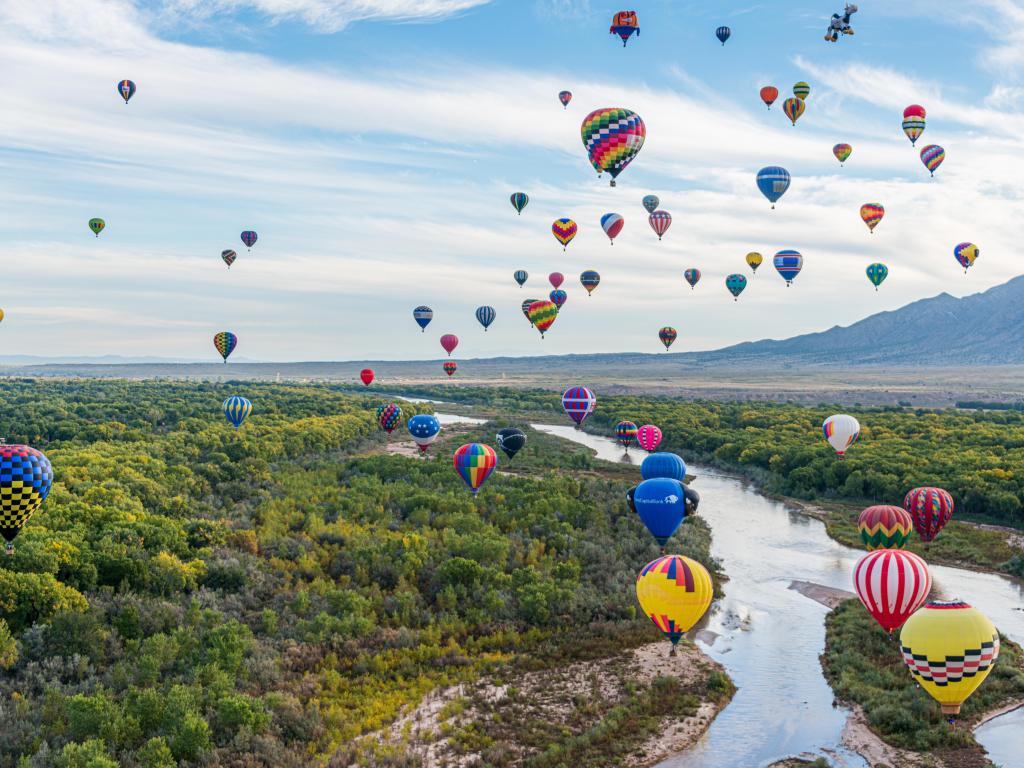 Albuquerque, New Mexico, USA taken during the Balloon Flight at the Albuquerque International Balloon Fiesta in Albuquerque above a river and trees.