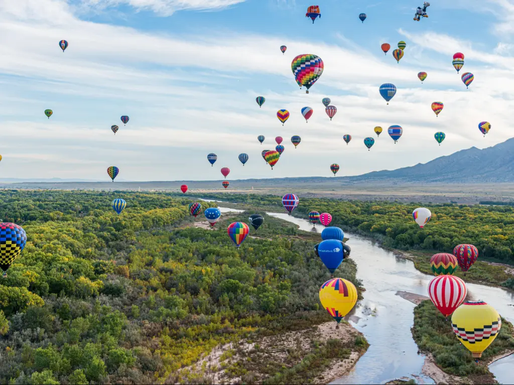 Albuquerque, New Mexico, USA taken during the Balloon Flight at the Albuquerque International Balloon Fiesta in Albuquerque above a river and trees.