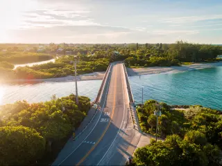 Drone shot during sunrise of bridge connecting Sanibel Island to Captiva Island.