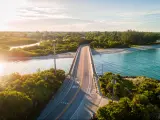 Drone shot during sunrise of bridge connecting Sanibel Island to Captiva Island.