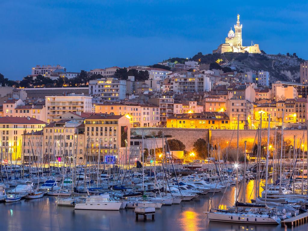 Marseille, France at night. The famous european harbour view on the Notre Dame de la Garde