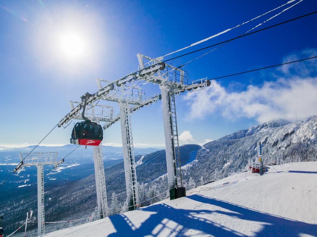 Gondola lift at the top of the Stowe Mountain Resort with mountain views in Vermont, USA.