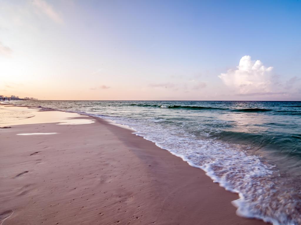 Miramar Beach, Florida, USA morning sunrise at the beach with white sand. 