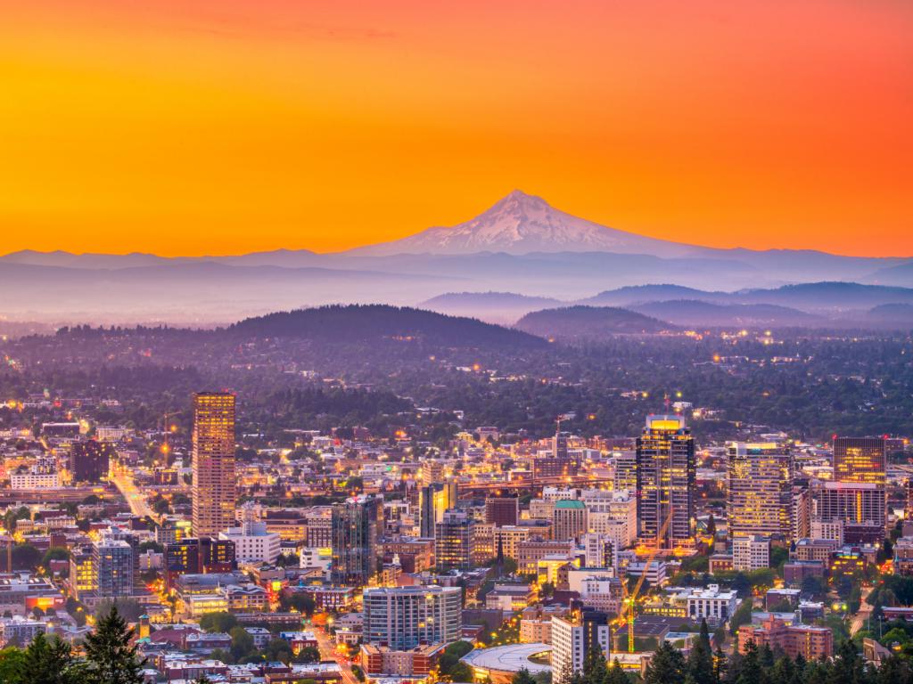 The skyline of Portland, Oregon, at sunrise with Mt Hood on the horizon