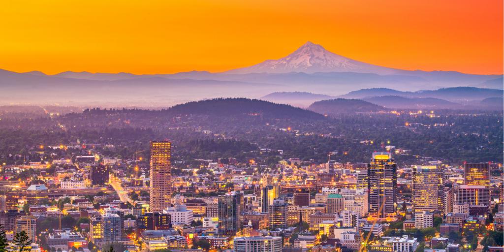 The skyline of Portland, Oregon, at sunrise with Mt Hood on the horizon