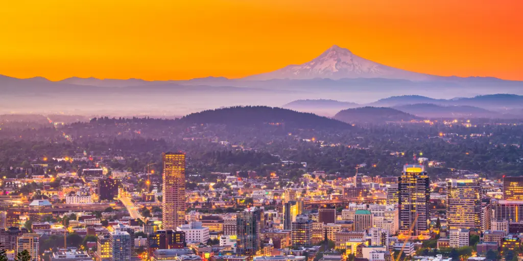 The skyline of Portland, Oregon, at sunrise with Mt Hood on the horizon