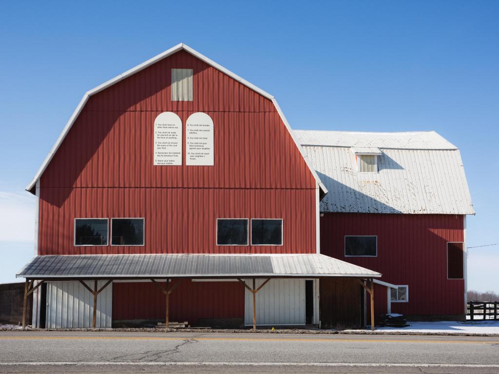 Close up shot of a traditional rustic red barn in Shipshewana, Indiana on a sunny day