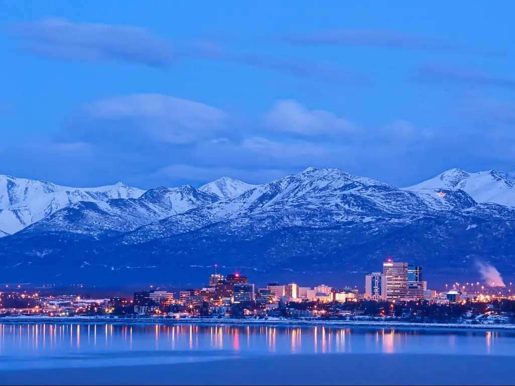 Anchorage Alaska skyline in winter at dusk with the Chugach mountains behind