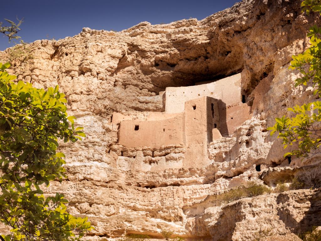 Montezuma's Castle National Monument, Arizona, USA - a hopi native american cliff dwelling in a mountain side made from stone and dirt.