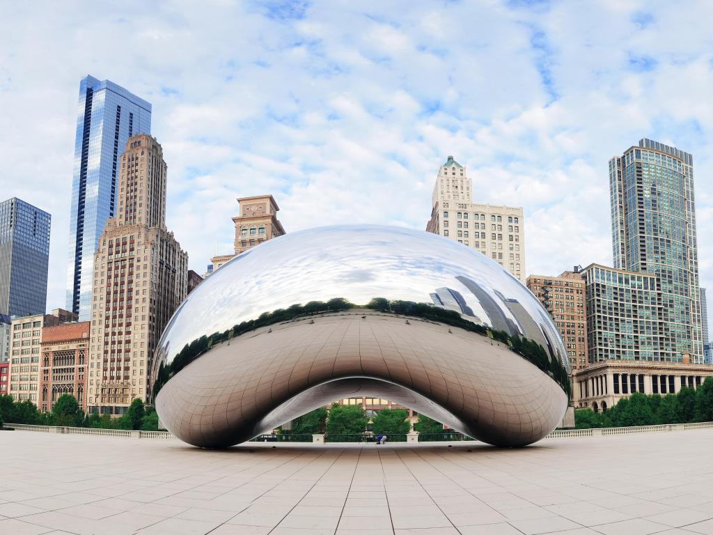 Cloud Gate and Chicago skyline on October 6, 2011 in Chicago, Illinois. Cloud Gate is the artwork of Anish Kapoor as the famous landmark of Chicago in Millennium Park.