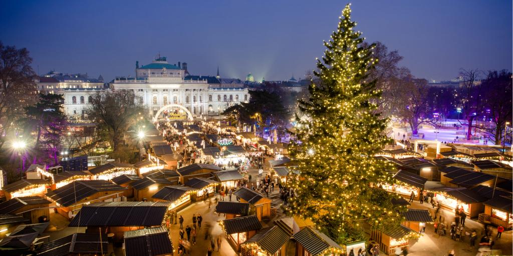 Fairy lights adorn the trees and buildings during Christmas in Vienna