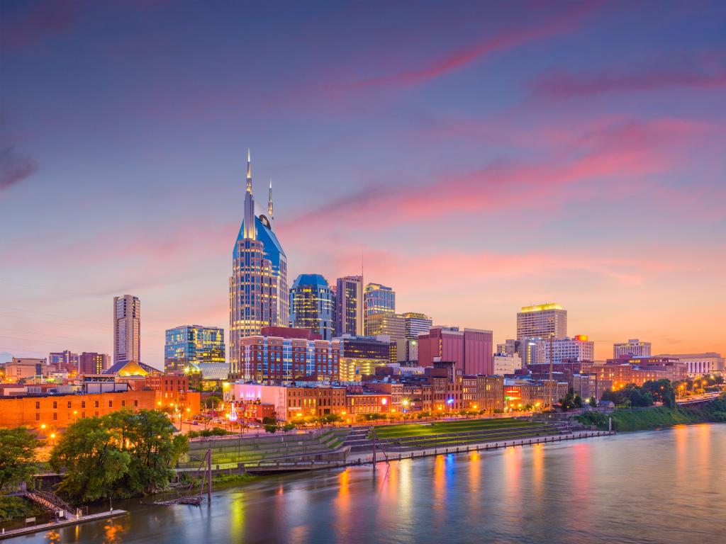 Nashville, Tennessee, USA downtown city skyline on the Cumberland River at early evening. 