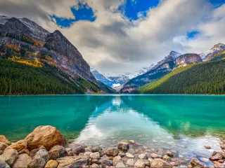 Banff National Park, Rocky Mountains, Alberta, Canada with beautiful autumn views of iconic Lake Louise, with the mountains and forest in the background.