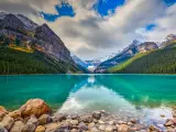 Banff National Park, Rocky Mountains, Alberta, Canada with beautiful autumn views of iconic Lake Louise, with the mountains and forest in the background.