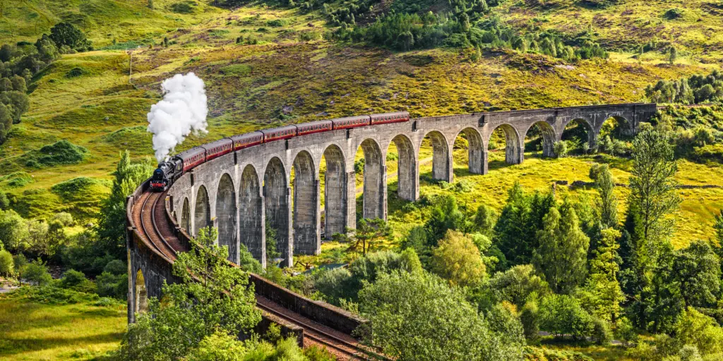 A train going over the Glenfinnan Viaduct in Scotland 