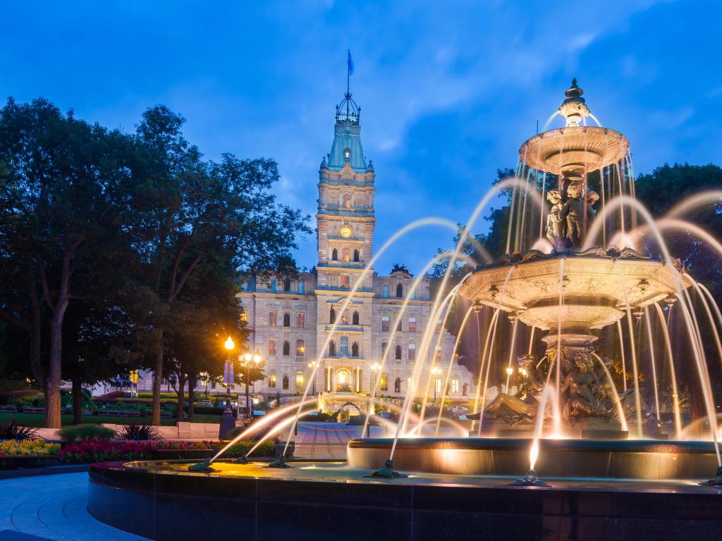 Quebec City, Quebec, Canada taken at The Quebec Parliament Building and the Fontaine de Tourny at twilight.