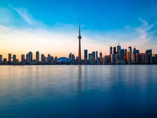 Famous skyline of Toronto after a sunset, with the city getting dark