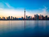 Famous skyline of Toronto after a sunset, with the city getting dark