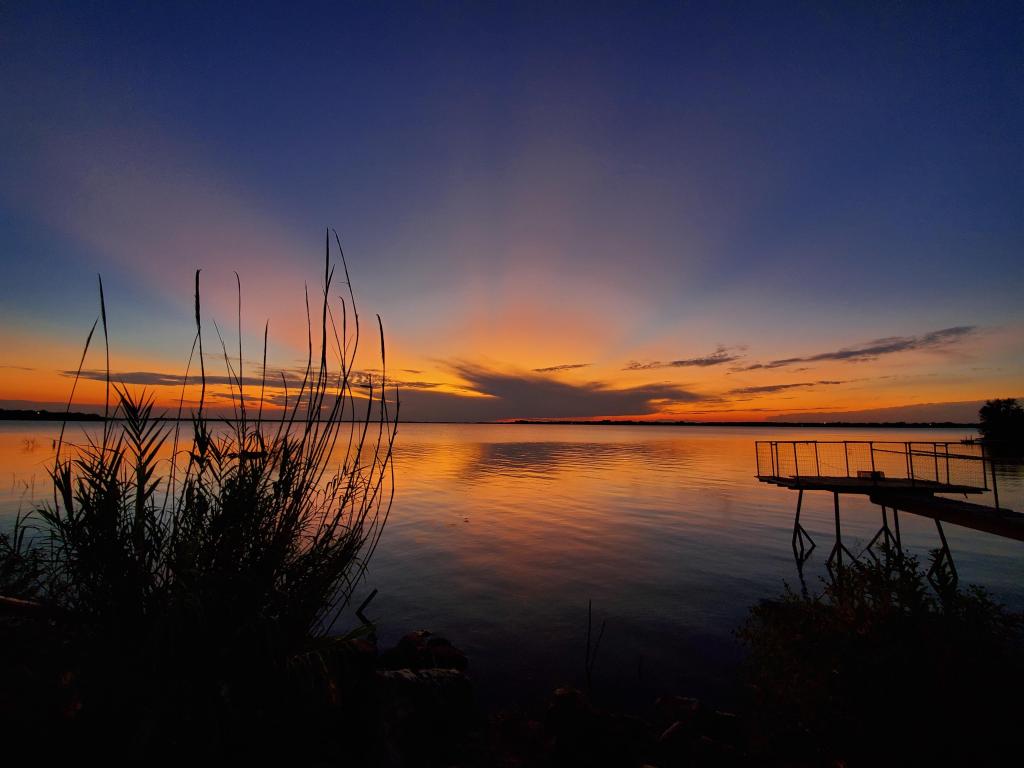 Beautiful orange sunset on Fort Phantom Hill Lake near Abilene.