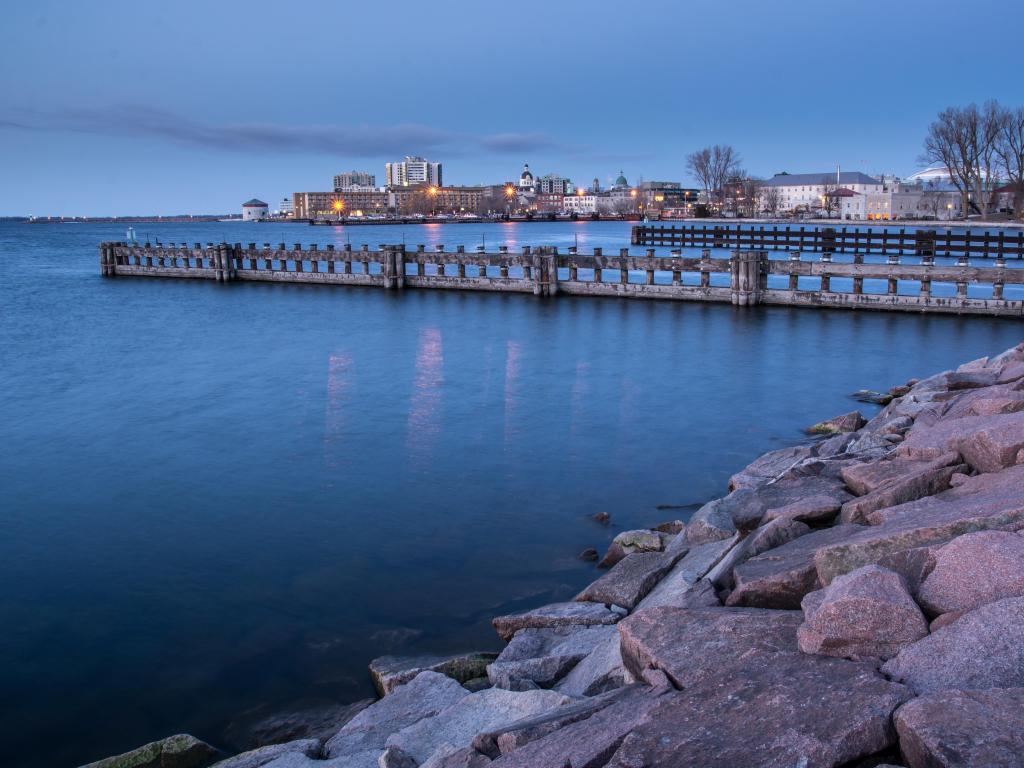 Kingston, Lake Ontario, Canada is a Canadian town on the Shore of Lake Ontario with the city in the distance.