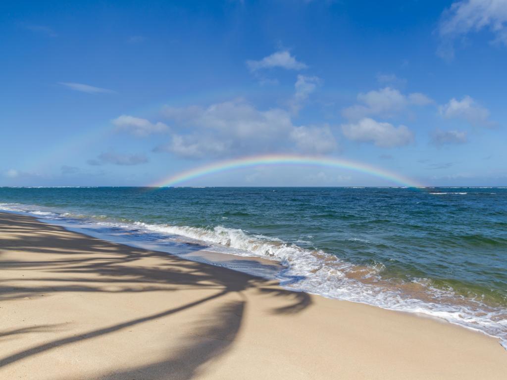 Double Rainbow on beach over the Ocean on the north shore of Oahu Hawaii