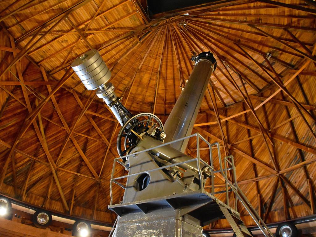 Interior of the observatory with the big telescope pointed at the sky