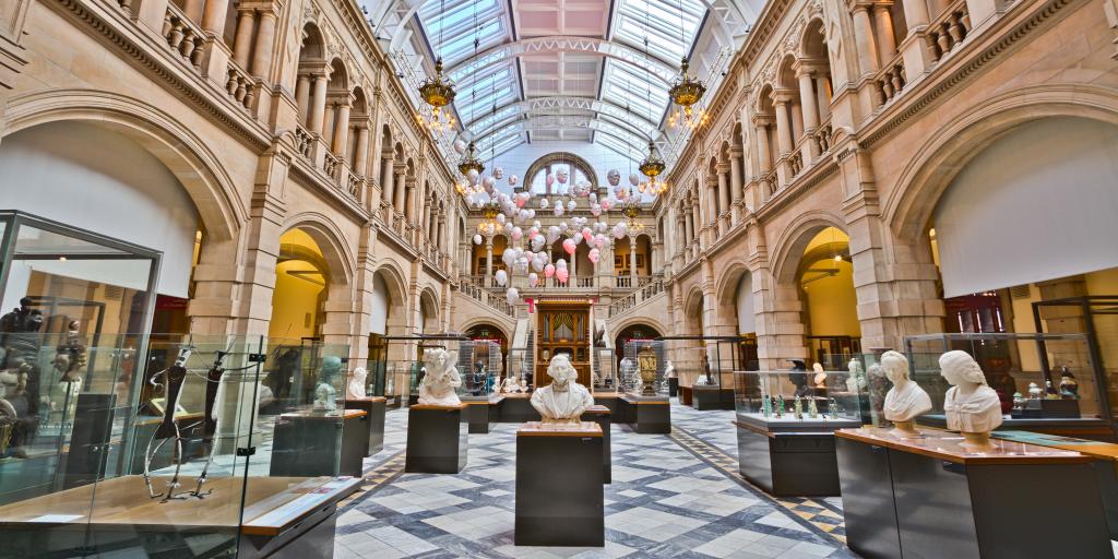 Busts and works of art on display in the immense and beautiful hall at Kelvingrove Art Gallery