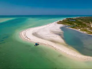 Florida beach. Paradise Summer vacation. Panorama of Caladesi island and Honeymoon Island State Park. Blue-turquoise color of salt water. Ocean or Gulf of Mexico. Tropical Nature. America. Aerial view