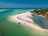 Florida beach. Paradise Summer vacation. Panorama of Caladesi island and Honeymoon Island State Park. Blue-turquoise color of salt water. Ocean or Gulf of Mexico. Tropical Nature. America. Aerial view