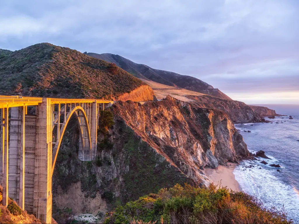 Bixby Bridge on Pacific Coast Highway on the US West Coast traveling south to Los Angeles from Big Sur Area, California, during a sunset