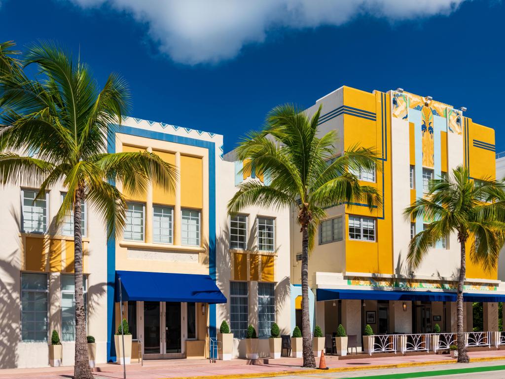 Yellow and blue art deco hotels in Miami on a sunny day