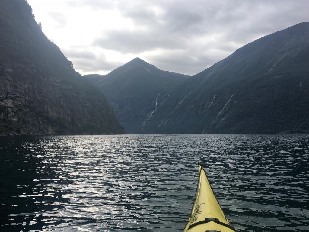 A view of the water and mountains from the kayak